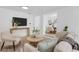 Cozy living room featuring stylish furniture, neutral colors, and ample natural light at 3381 19Th Sw Pl, Largo, FL 33774