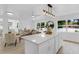 Bright and airy living room, flows to kitchen and dining, featuring lots of natural light at 3381 19Th Sw Pl, Largo, FL 33774