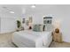 Well-lit bedroom with two windows, a chair and a bright color palette at 3381 19Th Sw Pl, Largo, FL 33774