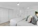 Bright bedroom with modern decor, large closets, and ceiling fan at 3381 19Th Sw Pl, Largo, FL 33774