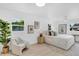 Spacious bedroom with modern decor, large windows, and neutral color palette at 3381 19Th Sw Pl, Largo, FL 33774
