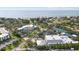 Stunning aerial view showcasing a coastal community with buildings nestled among lush greenery near the bay at 3415 Overlook Ne Dr, St Petersburg, FL 33703