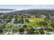 Panoramic aerial view of a residential area featuring a large park with baseball field and tennis courts at 3415 Overlook Ne Dr, St Petersburg, FL 33703