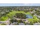 An aerial view of a community park showcasing tennis and basketball courts surrounded by a residential area at 3415 Overlook Ne Dr, St Petersburg, FL 33703