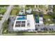 Aerial view showcases the property with a pool, parking, playground, and solar panels at 3415 Overlook Ne Dr, St Petersburg, FL 33703
