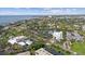 Picturesque aerial view of a coastal community with a mix of residential and commercial buildings near the water at 3415 Overlook Ne Dr, St Petersburg, FL 33703
