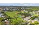 An aerial view shows a community park with a baseball field, and tennis courts nestled within a residential area at 3415 Overlook Ne Dr, St Petersburg, FL 33703