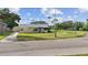 Charming single-story home with a well-manicured lawn and a detached garage at 3415 Overlook Ne Dr, St Petersburg, FL 33703