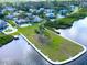 Panoramic aerial view showcasing the waterfront property with lush greenery and community amenities at 401 Windrush Bay Dr, Tarpon Springs, FL 34689