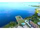 An expansive view of the bay and a tranquil green space with community pool at 401 Windrush Bay Dr, Tarpon Springs, FL 34689