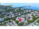 An aerial view of the neighborhood's layout, water views and surrounding greenery at 401 Windrush Bay Dr, Tarpon Springs, FL 34689