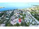 A beautiful aerial view of the neighborhood with mature trees and landscaping near waterfront views at 401 Windrush Bay Dr, Tarpon Springs, FL 34689