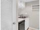 Functional kitchen featuring a double sink and modern dishwasher at 401 Windrush Bay Dr, Tarpon Springs, FL 34689