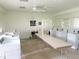 Clean laundry room features rows of washing machines, folding table, and bright lighting at 401 Windrush Bay Dr, Tarpon Springs, FL 34689