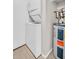 Efficient laundry area with a stacked washer and dryer, plus a water heater at 401 Windrush Bay Dr, Tarpon Springs, FL 34689
