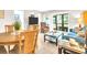 Inviting living room and dining area featuring tile floors, comfortable seating, and plenty of natural light at 401 Windrush Bay Dr, Tarpon Springs, FL 34689