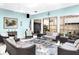 Inviting sunroom features comfortable seating, a ceiling fan, and views of the lush outdoors at 401 Windrush Bay Dr, Tarpon Springs, FL 34689