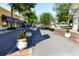 Charming town street view, lined with trees and planter boxes along storefronts and houses at 401 Windrush Bay Dr, Tarpon Springs, FL 34689