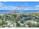 Aerial view showcases the home's proximity to Honeymoon Island and the Pinellas Trail at 412 Mira Vista Dr, Dunedin, FL 34698