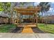 Picturesque backyard featuring a charming pergola, perfect for outdoor relaxation and entertaining at 412 Mira Vista Dr, Dunedin, FL 34698