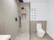 Modern bathroom featuring sleek fixtures and a spacious glass-enclosed shower, offering a spa-like experience at 412 Mira Vista Dr, Dunedin, FL 34698