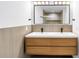 Bright bathroom featuring a floating double sink vanity, large mirror, and modern lighting at 412 Mira Vista Dr, Dunedin, FL 34698