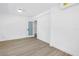 Minimalist bedroom featuring sleek floors, ample light, and modern fixtures at 412 Mira Vista Dr, Dunedin, FL 34698