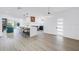 Bright open-concept kitchen featuring a large island with seating, stainless steel appliances, and modern finishes at 412 Mira Vista Dr, Dunedin, FL 34698