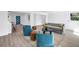 Bright living room featuring modern furniture and an open layout, creating an inviting and comfortable atmosphere at 412 Mira Vista Dr, Dunedin, FL 34698