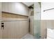 Updated shower with glass enclosure and gray textured tile surround with black hardware at 412 Mira Vista Dr, Dunedin, FL 34698