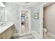 Bathroom featuring a doorway to the hallway and views of the bedroom and waterfront at 415 Island Way # 507, Clearwater Beach, FL 33767