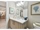 Well-lit bathroom with a contemporary vanity, sleek fixtures, and modern decorations at 415 Island Way # 507, Clearwater Beach, FL 33767