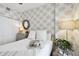Cozy bedroom features palm wallpaper, natural light, comfortable bed, and stylish decor at 415 Island Way # 507, Clearwater Beach, FL 33767