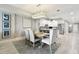 Dining area with chandelier, seating for six, and flows to a modern kitchen at 415 Island Way # 507, Clearwater Beach, FL 33767