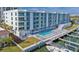 Stunning waterfront condominium featuring a pool, private boat slips, and modern architectural design at 415 Island Way # 507, Clearwater Beach, FL 33767
