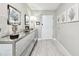 Stylish hallway featuring a mirrored console table, recessed lighting, and artistic wall decor at 415 Island Way # 507, Clearwater Beach, FL 33767