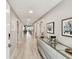 Elegant hallway featuring modern decor, recessed lighting, and a glimpse of waterfront views at 415 Island Way # 507, Clearwater Beach, FL 33767