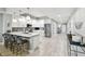 Modern kitchen with a spacious island, stainless steel appliances, and sleek white cabinetry at 415 Island Way # 507, Clearwater Beach, FL 33767