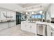 This modern kitchen features an island and stainless steel appliances, perfect for cooking and entertaining at 415 Island Way # 507, Clearwater Beach, FL 33767