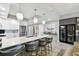 Stylish kitchen with a large island, bar seating, stainless steel appliances and wine storage at 415 Island Way # 507, Clearwater Beach, FL 33767