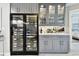 The kitchen includes a wine fridge and glass storage at 415 Island Way # 507, Clearwater Beach, FL 33767