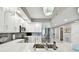 Beautiful kitchen with white cabinets, stainless steel appliances, and a mosaic tile backsplash at 415 Island Way # 507, Clearwater Beach, FL 33767
