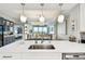 This kitchen has a stainless steel sink and a view into the dining room at 415 Island Way # 507, Clearwater Beach, FL 33767