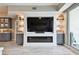 This living room is equipped with a TV, fireplace, and view of a balcony at 415 Island Way # 507, Clearwater Beach, FL 33767