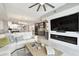 This living room includes a fireplace, TV, sofa, and flows into the kitchen at 415 Island Way # 507, Clearwater Beach, FL 33767