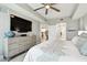 This view of the primary bedroom looks back toward the doorway and shows a glimpse of the kitchen at 415 Island Way # 507, Clearwater Beach, FL 33767