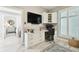 Well-lit home office featuring custom built-ins, desk space, and a view to the Primary bedroom at 415 Island Way # 507, Clearwater Beach, FL 33767