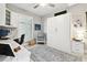 Bright office space featuring built-in cabinets, a Murphy bed, and a desk with marble countertops at 415 Island Way # 507, Clearwater Beach, FL 33767