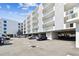 Modern condo building with parking and balconies at 415 Island Way # 507, Clearwater Beach, FL 33767
