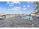 Community outdoor pool with lounge chairs and views of the waterfront at 415 Island Way # 507, Clearwater Beach, FL 33767